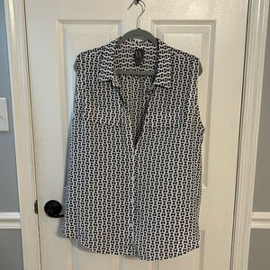 Black and white sleeveless blouse.